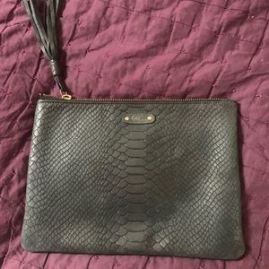 Vintage GiGi New York black leather clutch with tassel pull.